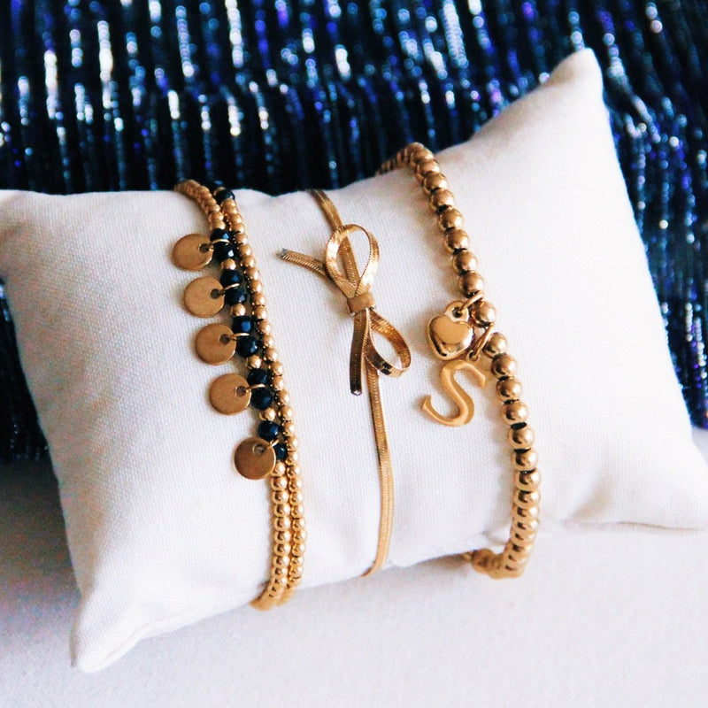 Platte slangenarmband met strik