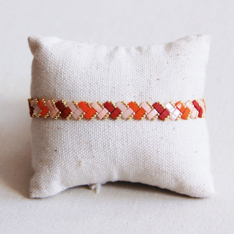 Gevlochten Tila kralenarmband - Zalm/Oranje/Bordeaux