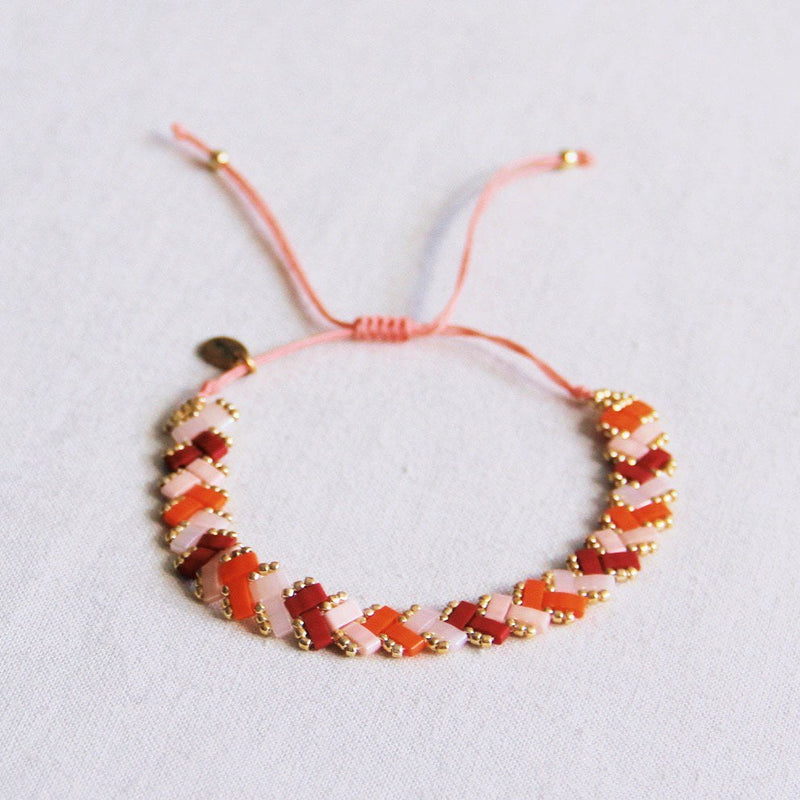Gevlochten Tila kralenarmband - Zalm/Oranje/Bordeaux